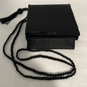 Black clutch, beaded strap, perfect condition, good for the holidays!